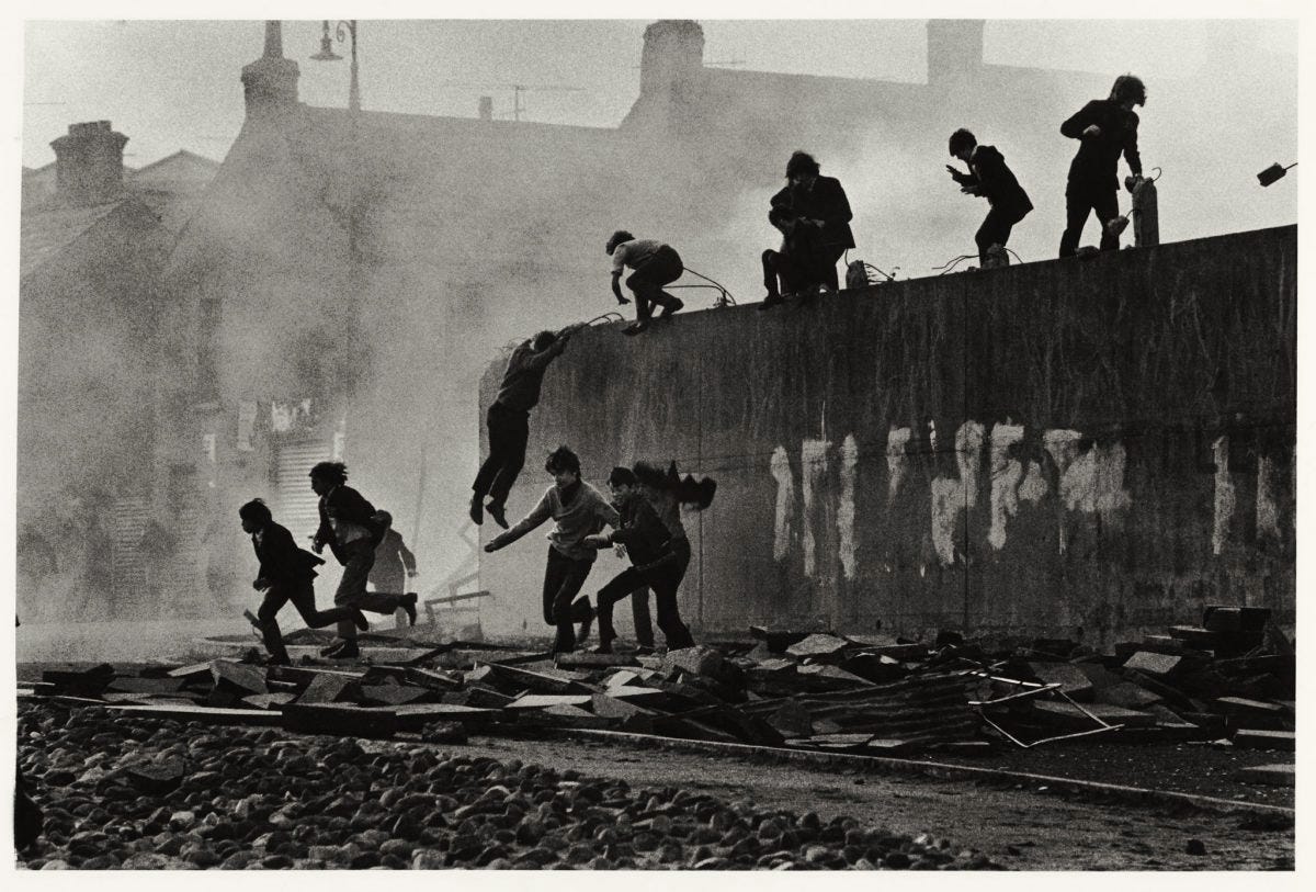 1971 photo by Don McCullin of Catholic kids escaping gas in Londonderry