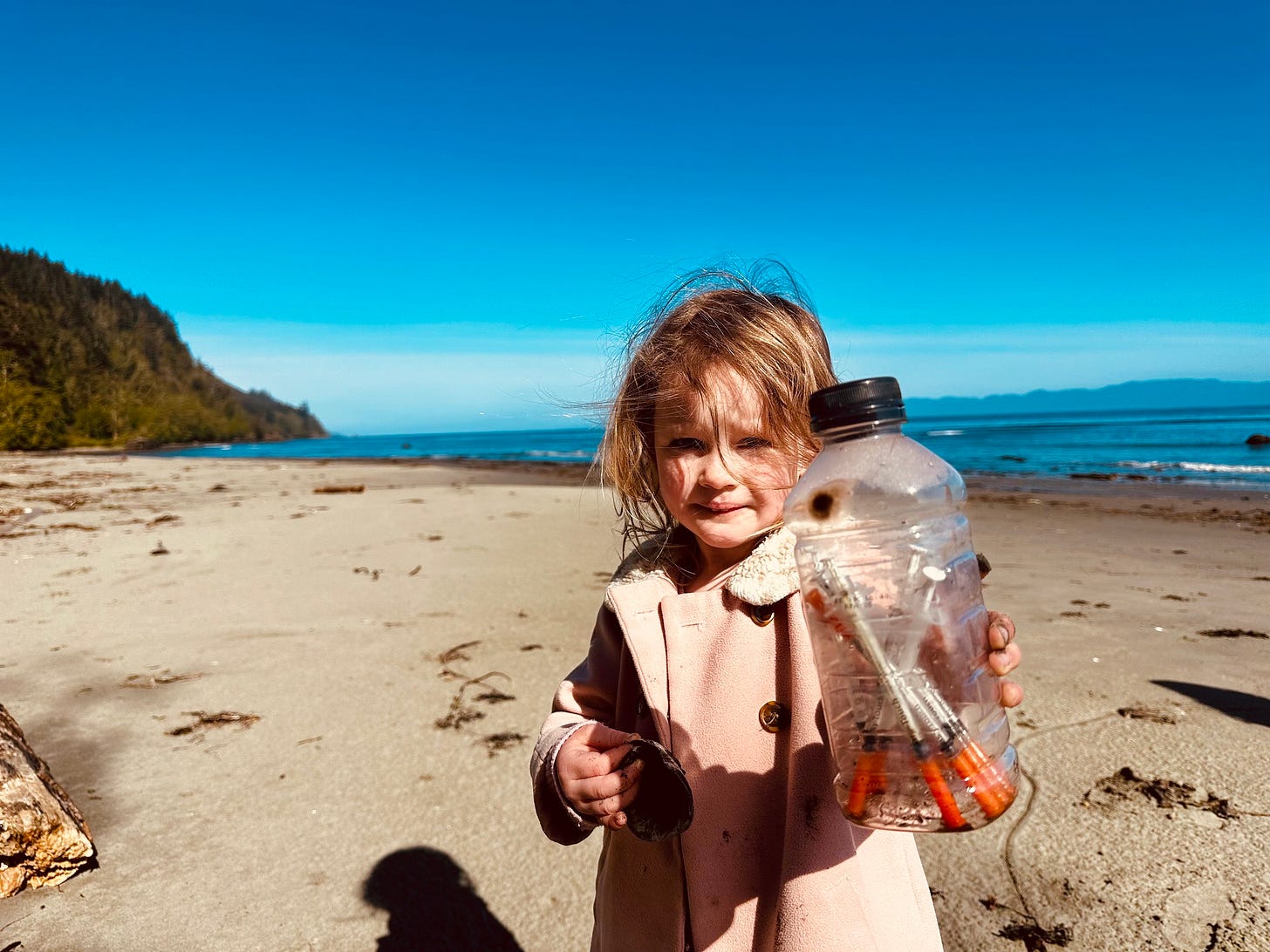 May be an image of child and body of water