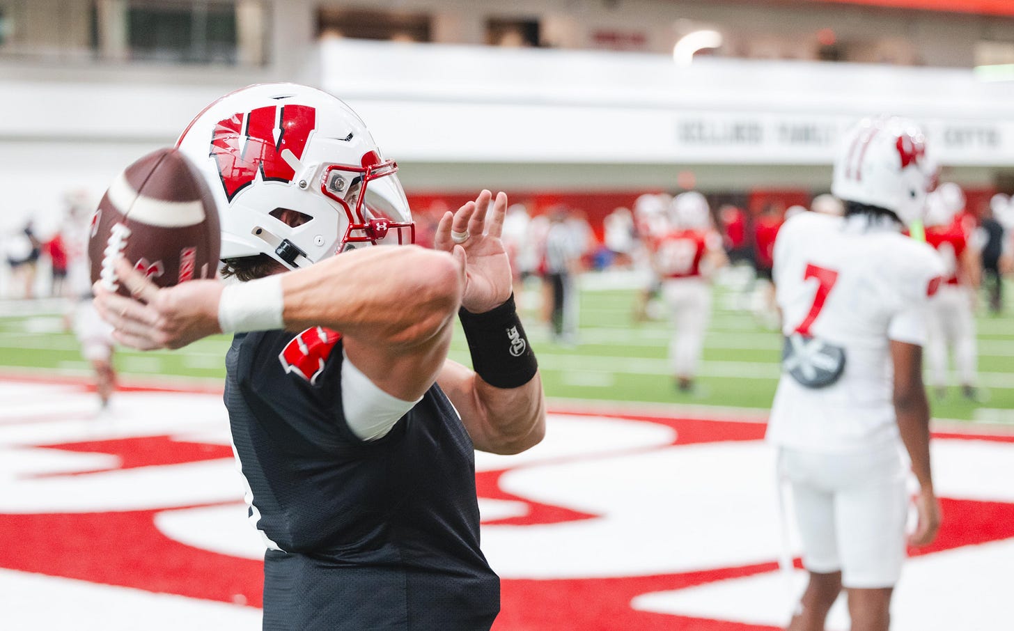 Wisconsin quarterback Colton Joseph drops back to pass during practice inside the Kellner Family Athletic Center. Wisconsin quarterback Colton Joseph drops back to pass during practice inside the Kellner Family Athletic Center.