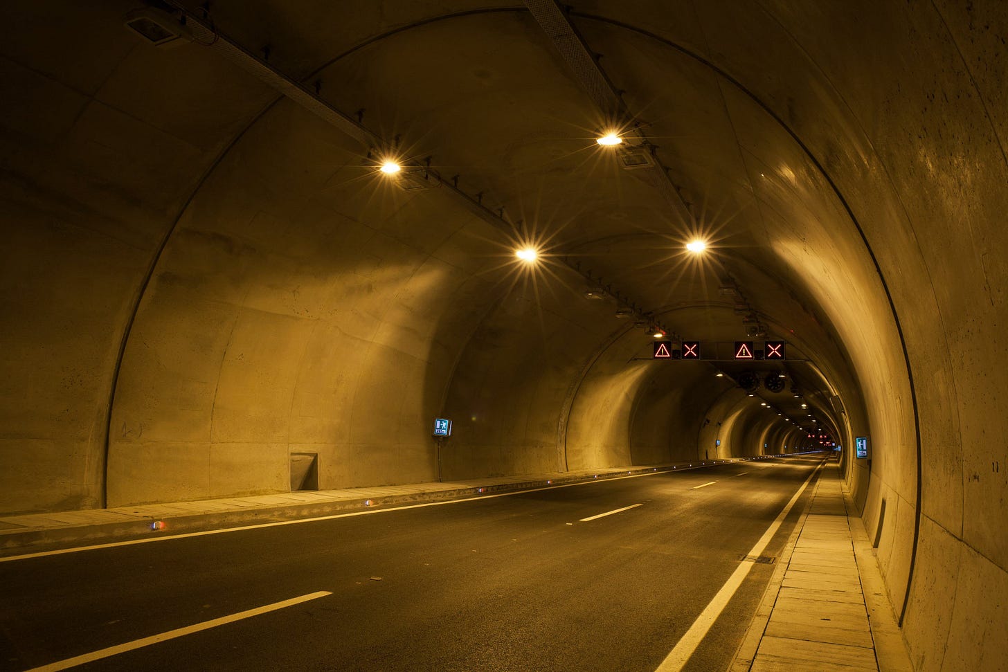 Driving through a highway tunnel looking for the end is like listening for guidance on life direction