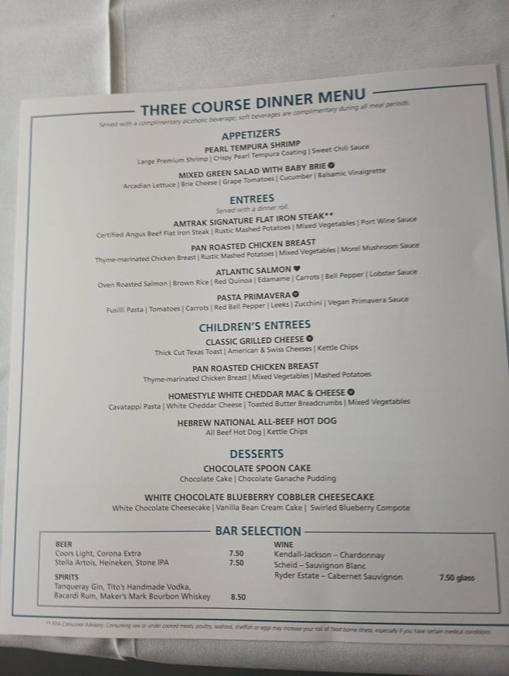 Bunn coffee maker, looking down the dining car on one train, looking down another dining car, the menu, chicken dinner on the train