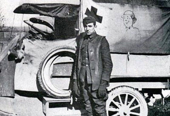 Disney historical photo: A young Walt Disney in France in front of Red Cross ambulance he drove - Disney Diary Disney historical photo: A young Walt Disney in France in front of Red Cross ambulance he drove - Disney Diary