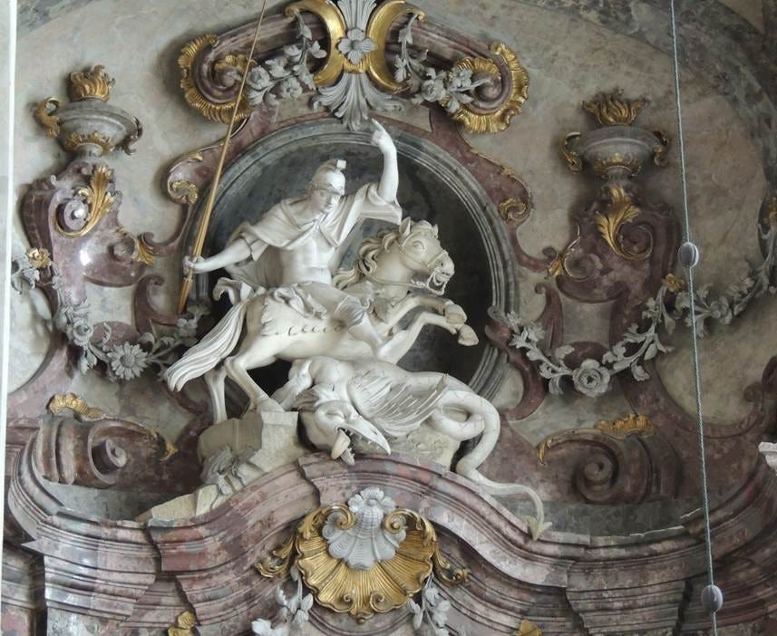 A statue of a person riding a horse

AI-generated content may be incorrect.