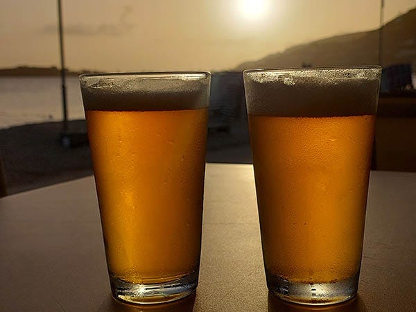 2 craft beers at sunset for happy hour at Seaview Beach Hotel, Sint Maarten, Caribbean