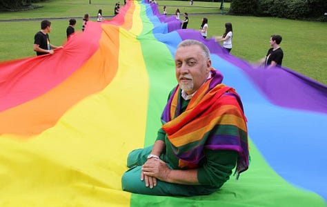 Three historical images showing Gilbert Baker’s mile-long rainbow flag from 1994. The first is an aerial view of the flag running down a packed New York City street. The second shows Gilbert Baker sitting on the flag in a park, surrounded by people holding it up. The third is a street-level view of LGBTQIA+ activists marching with a section of the flag in front of St. Patrick’s Cathedral, raising fists and celebrating queer liberation.
