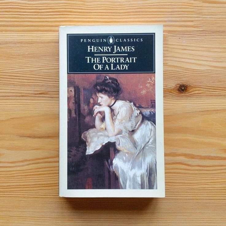 This may contain: the portrait of a lady by henry james on a wooden table with wood grains This may contain: the portrait of a lady by henry james on a wooden table with wood grains