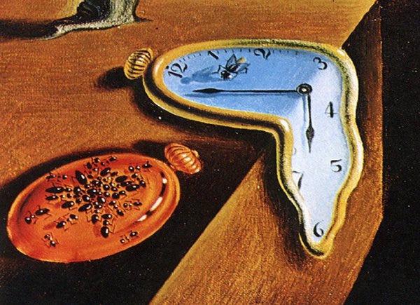 close up detail of Dali's melting clock (writing over 50)