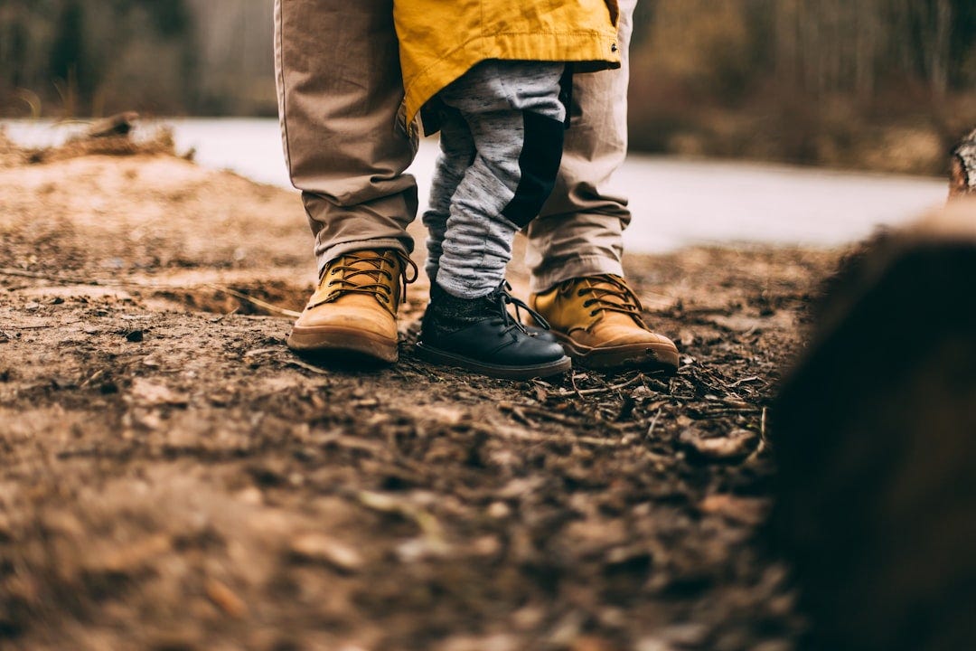 two person step on gray soil two person step on gray soil