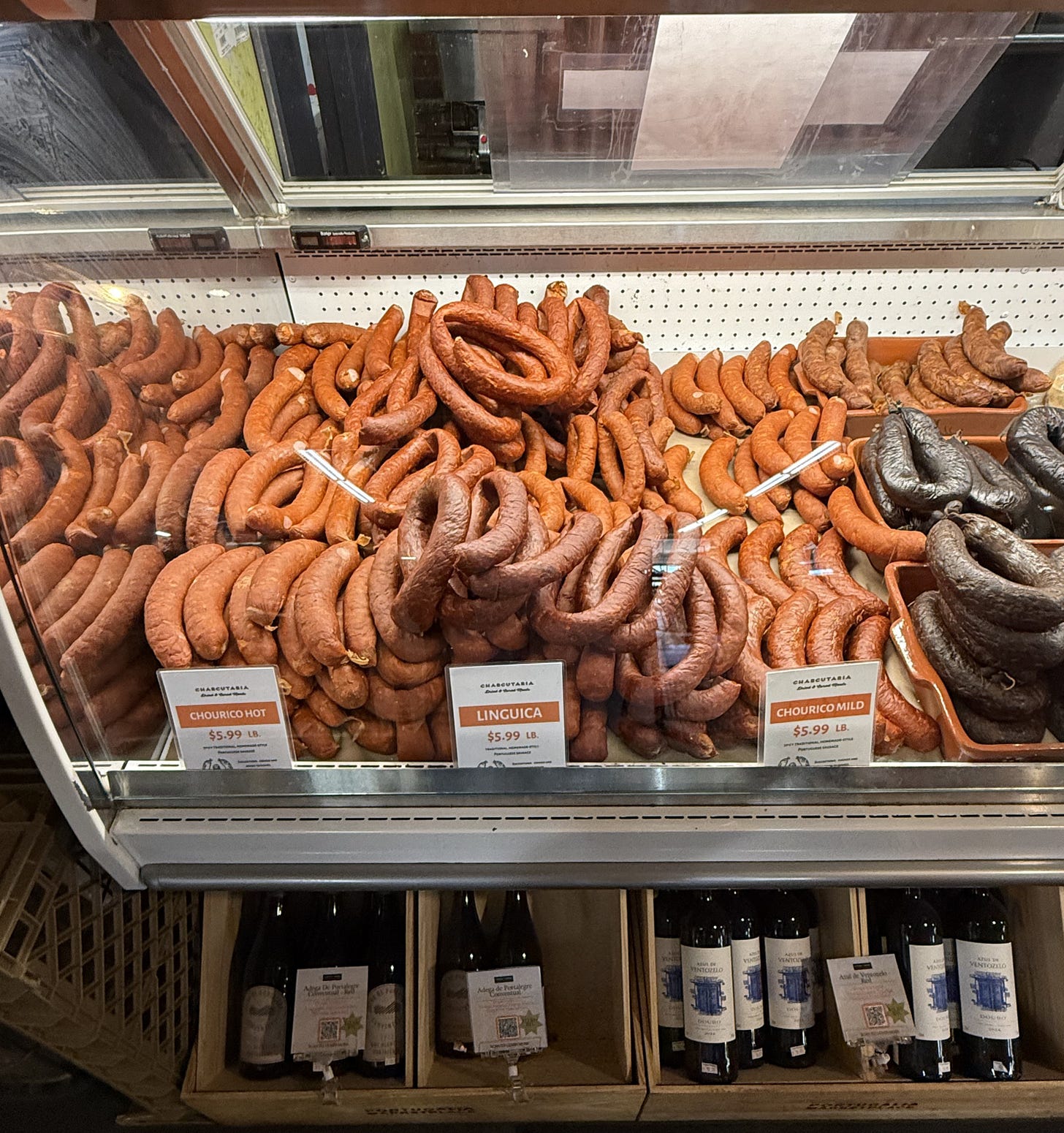 Display case filled with varieties of Portuguese sausage, including linguiça and chouriço, at Portugalia Marketplace in Fall River, MA. Display case filled with varieties of Portuguese sausage, including linguiça and chouriço, at Portugalia Marketplace in Fall River, MA.