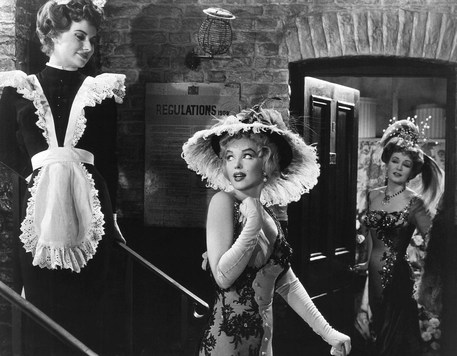 People calling Marilyn Monroe “the most shameless woman this town has ever seen”  in The Prince and the Showgirl.