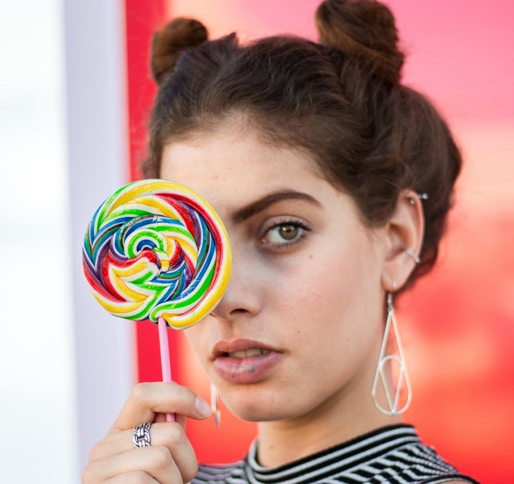 Picture of woman holding lollipop