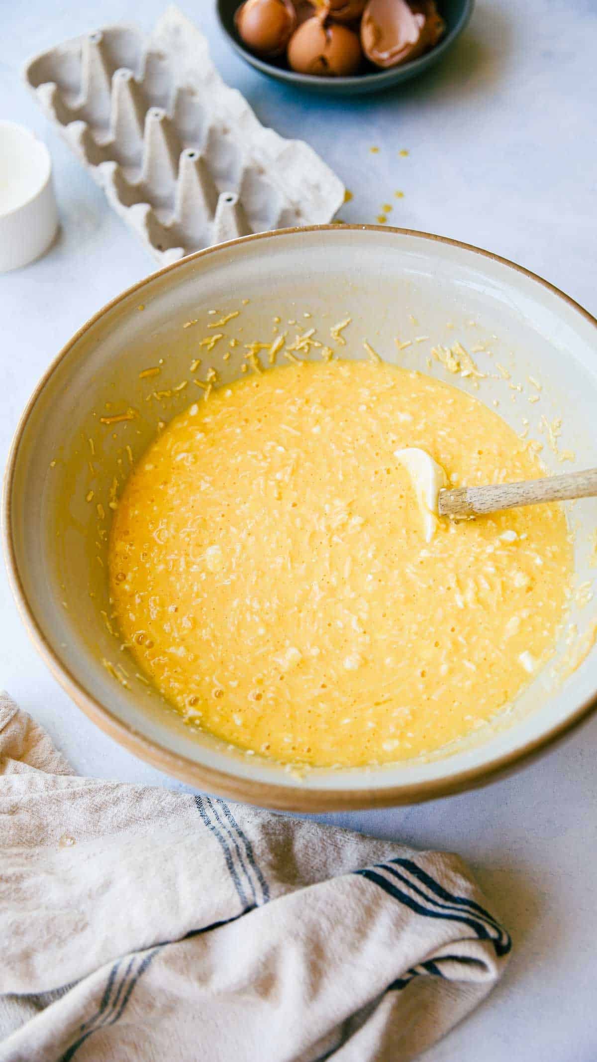 a mixing bowl filled with egg batter a mixing bowl filled with egg batter