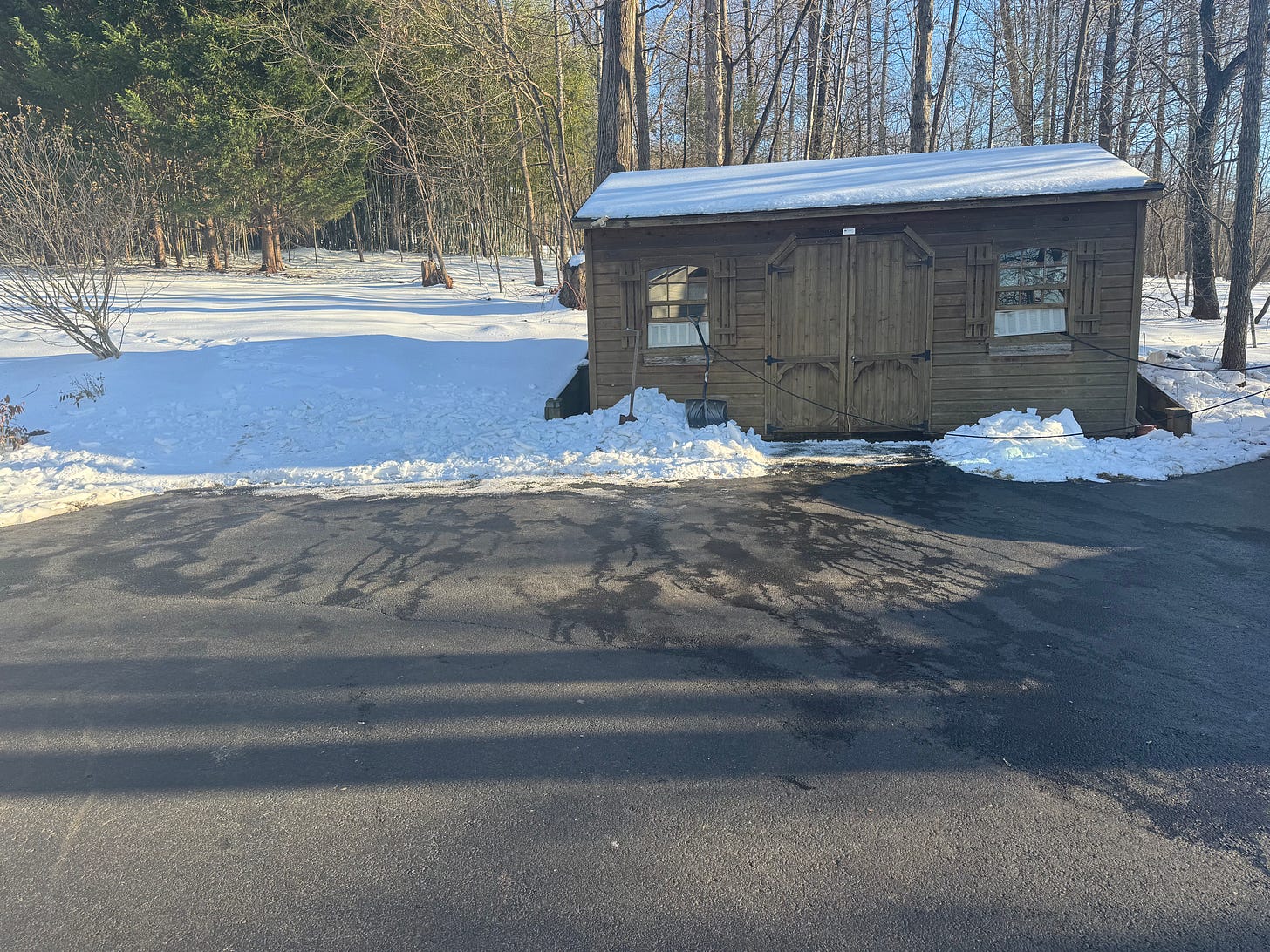 Next day picture of same location on driveway, where the sheath of ice is completely gone thanks to the morning sun.
