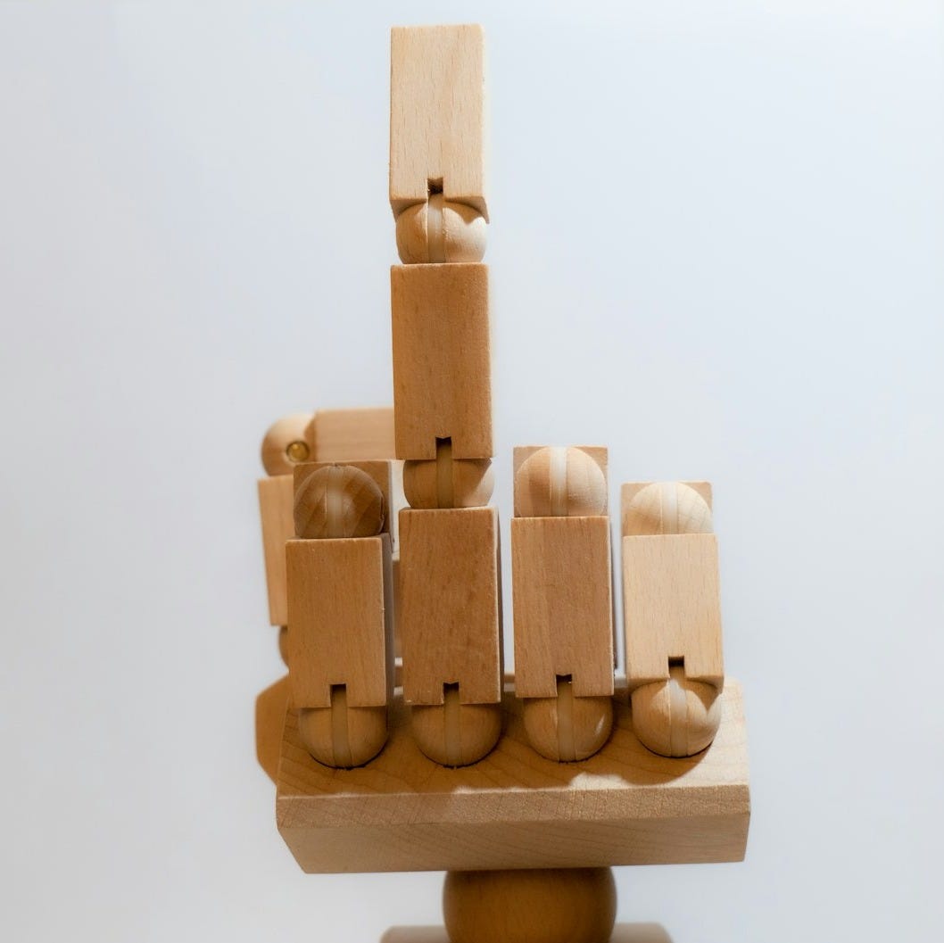a sculpture made of wooden blocks and balls a sculpture made of wooden blocks and balls