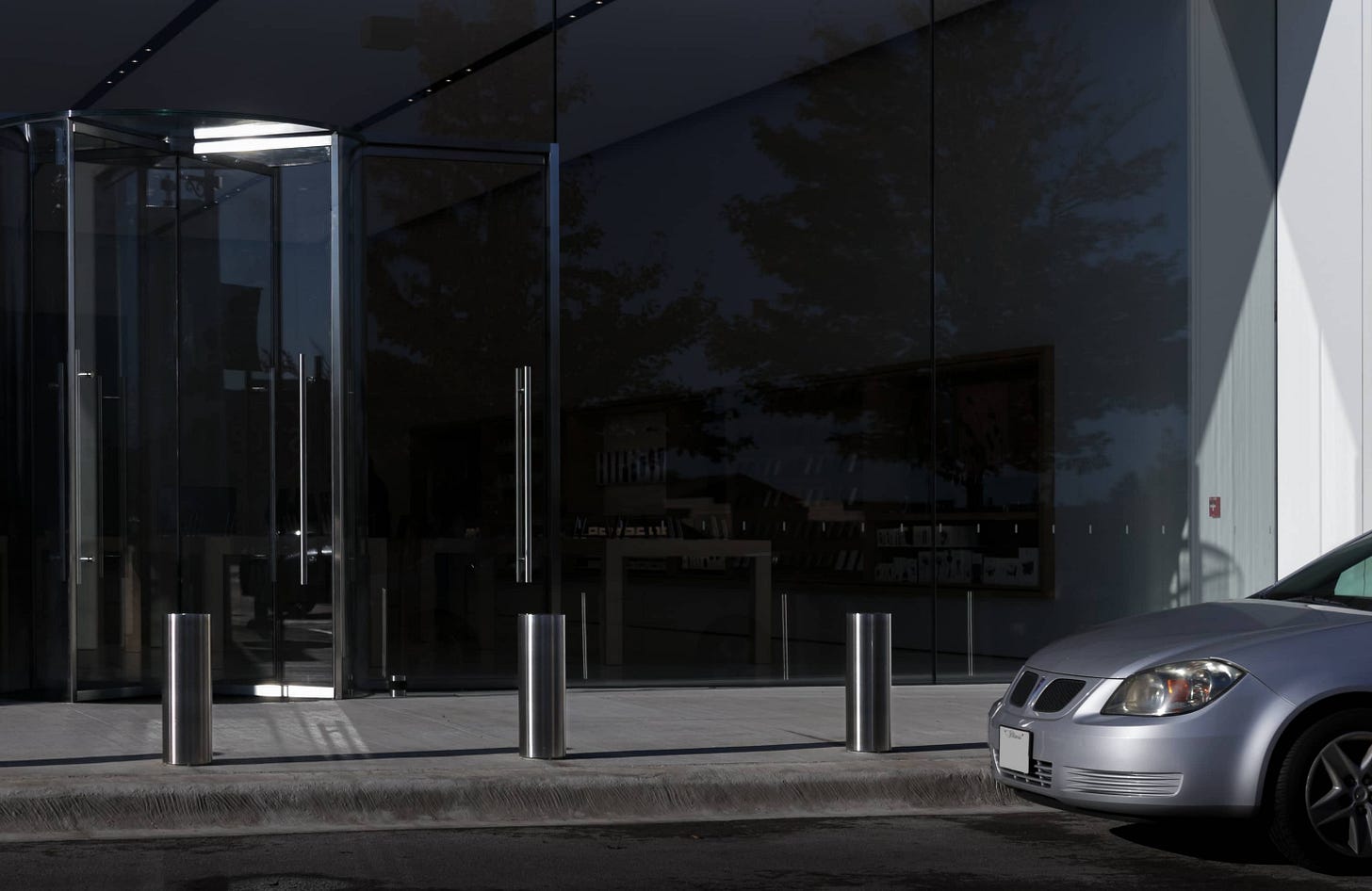 Bollards in front of an Apple Store.