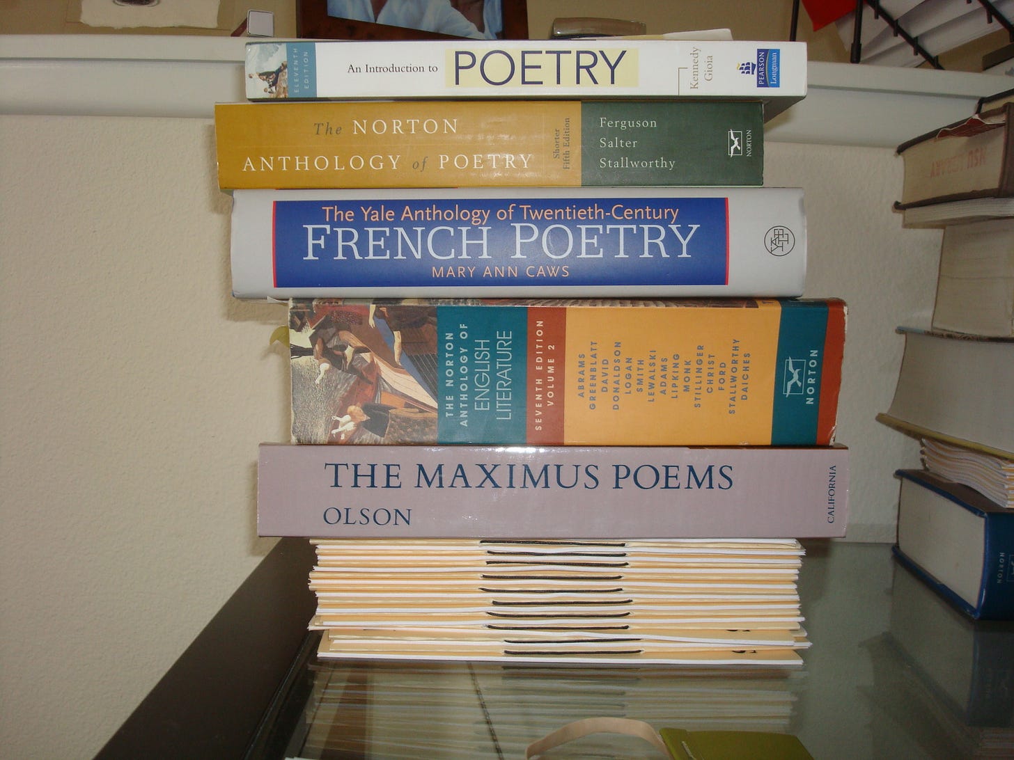 Poetry anthologies and collections on top of some hand-bound chapbooks. Poetry anthologies and collections on top of some hand-bound chapbooks.