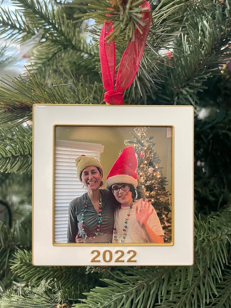 Photo ornament hanging on Christmas tree