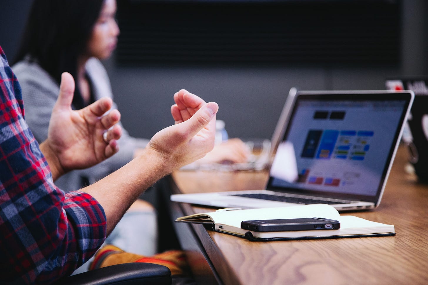 Man talking with hands in meeting
