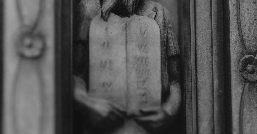 gray concrete statue of a woman