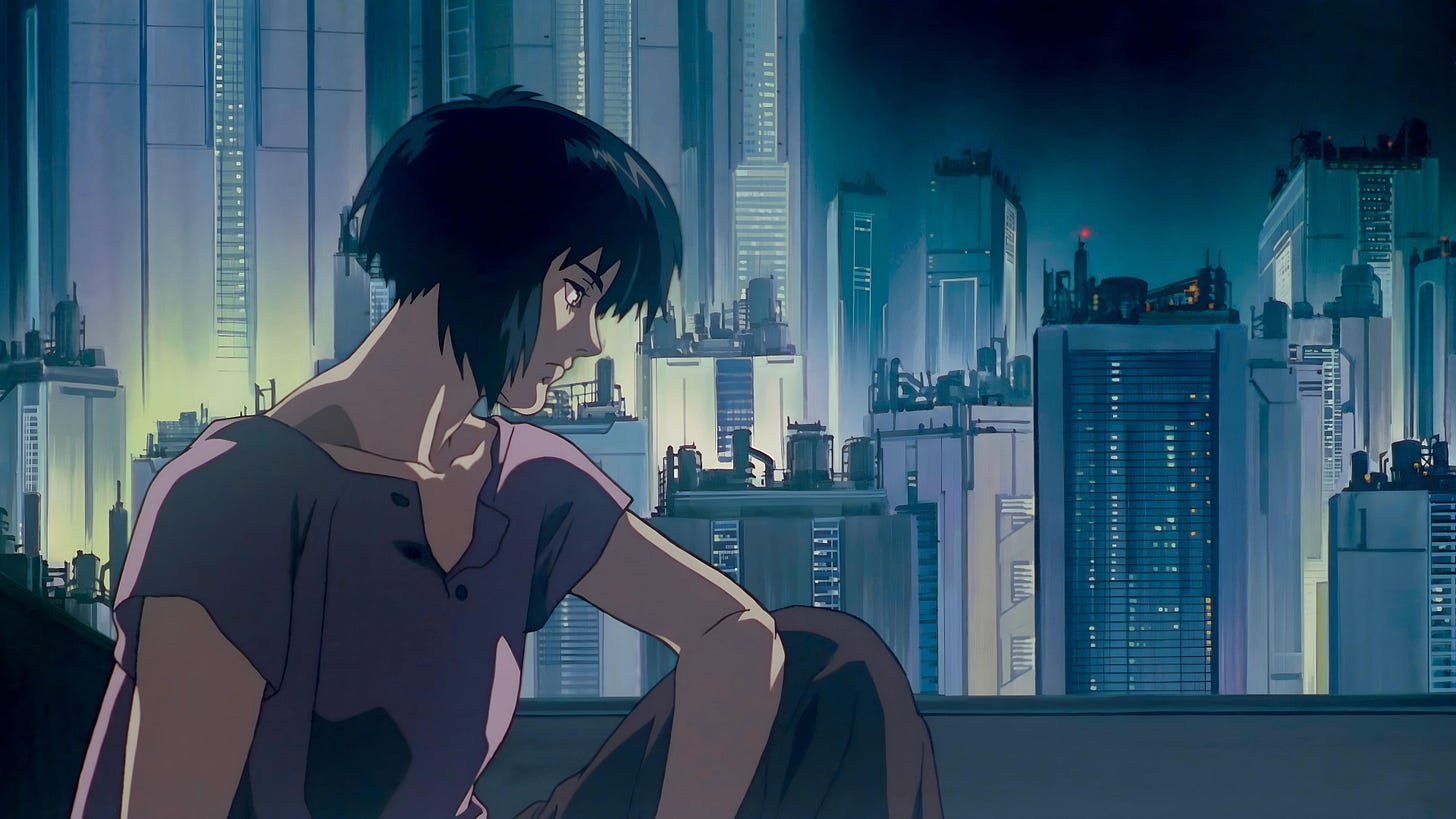 Ghost in the Shell | Still features protagonist Motoko against a cityscape.