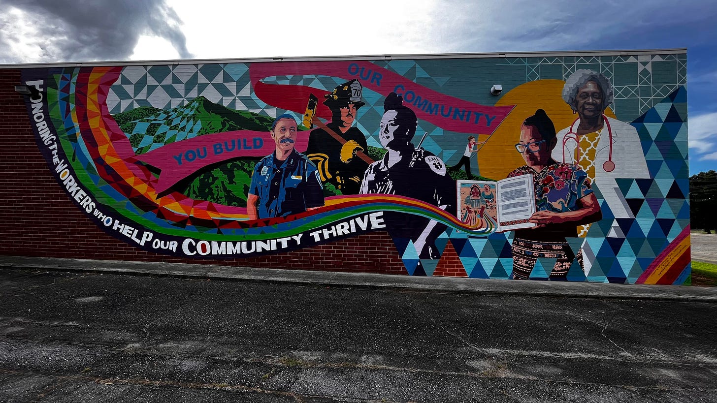 Photo of the Essential Workers Mural on the side of a building at the Industrial Commons.