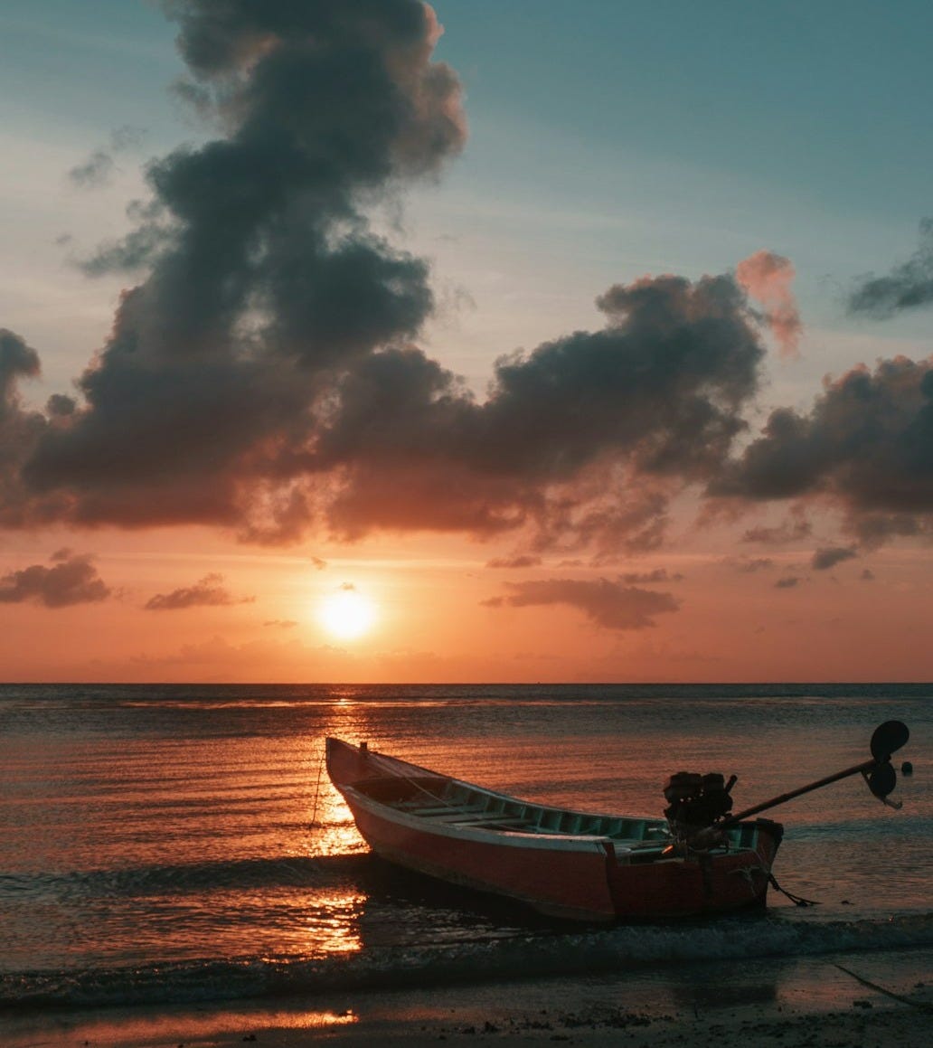 red boat and clouds