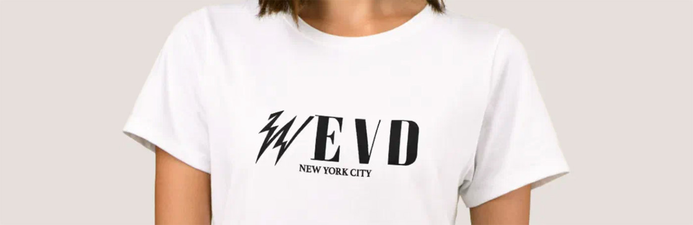 Woman wearing white t-shirt with graphic of radio station logo WEVD