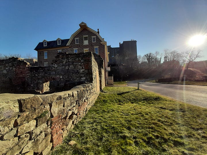 Old stone buildings, including a blacksmith shop, stand in Bethlehem PA.