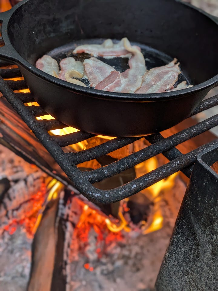 Roasted tomato soup with grilled cheese (and bacon!) cooking over our camp fire last month