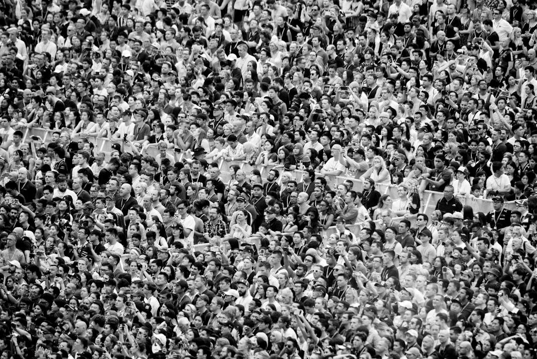 group of people attending concert group of people attending concert