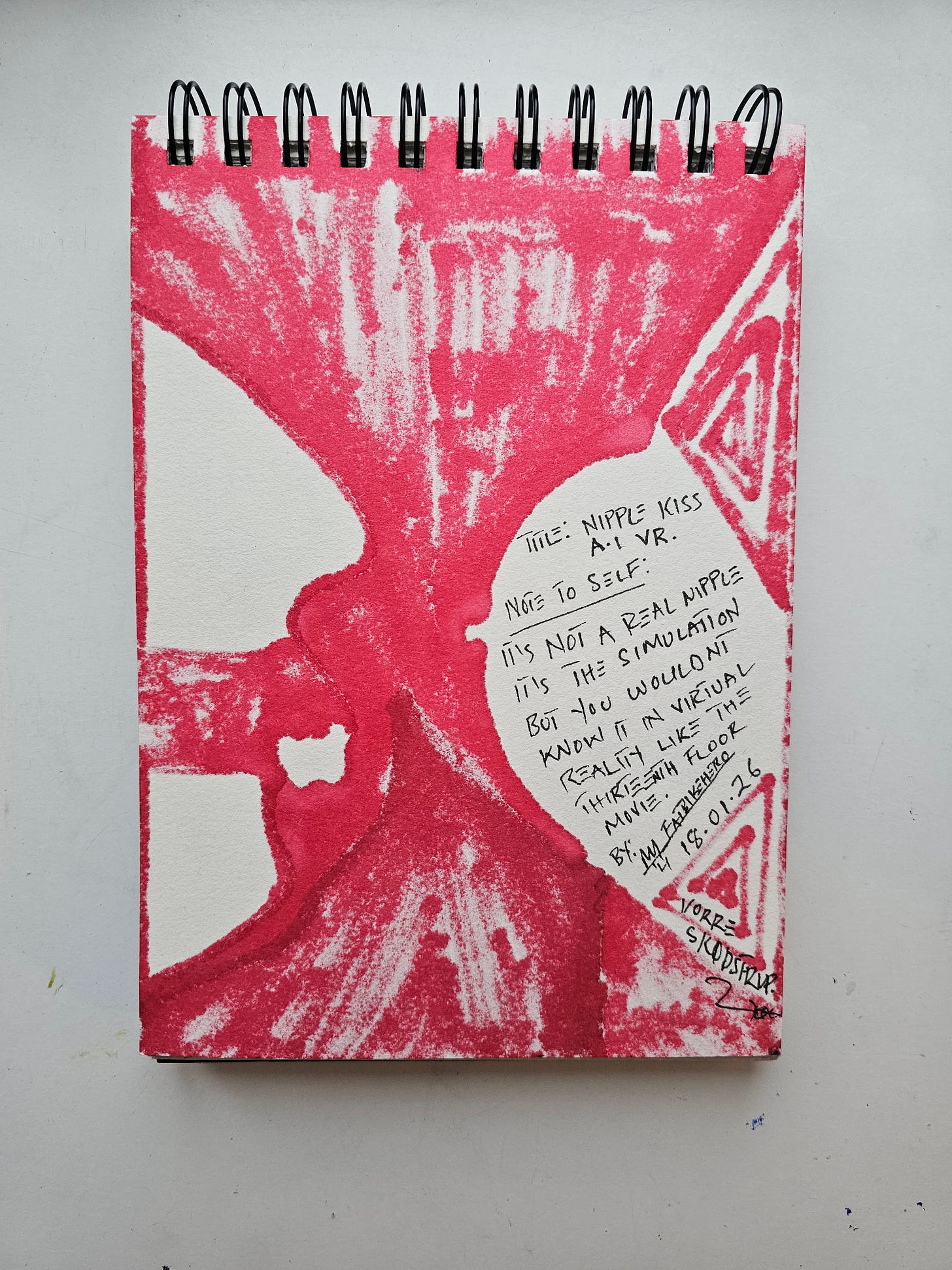  The reverse side of a sketchbook page covered in a red ink wash. Handwritten black text in the center reads: "TITLE: NIPPLE KISS A.I VR. NOTE TO SELF: IT'S NOT A REAL NIPPLE IT'S THE SIMULATION BUT YOU WOULDN'T KNOW IT IN VIRTUAL REALITY LIKE THE THIRTEENTH FLOOR MOVIE. BY: MJ FATBIKEHERO 18.01.26 VORRE SKØDSTRUP."
