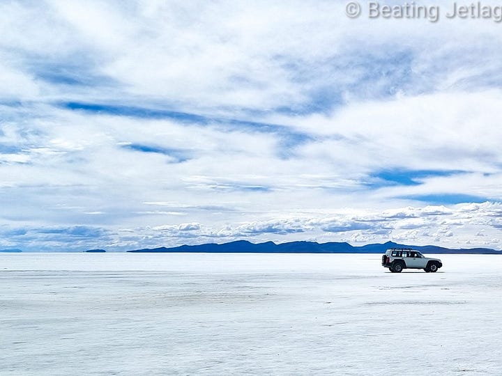 Views of Salar de Uyuni and a volcano in the desert in Bolivia