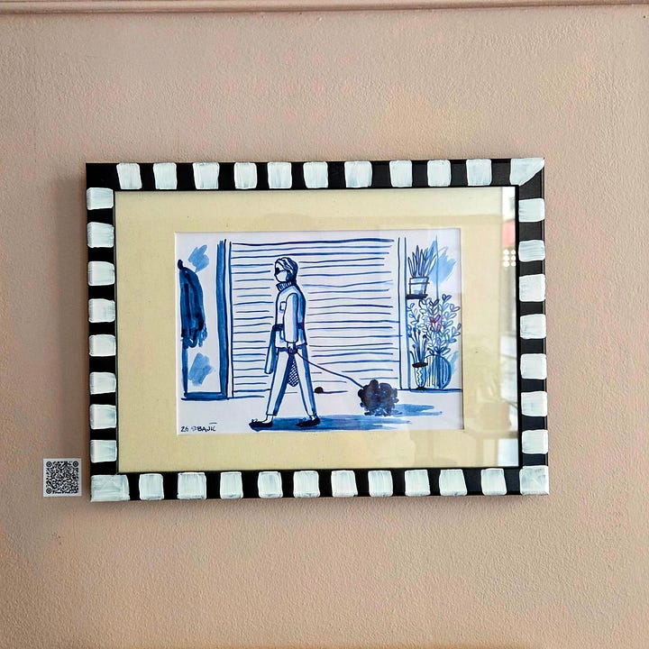 Framed art pieces in blue ink for sale. On a wall