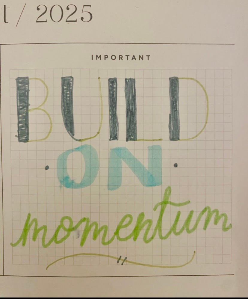 Lettering I did that says Build on momentum