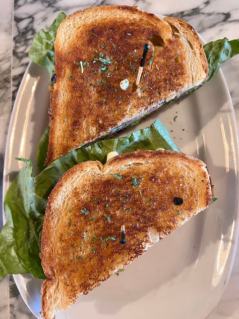a bacon lettuce and tomatoe sandwich on sourdough bread