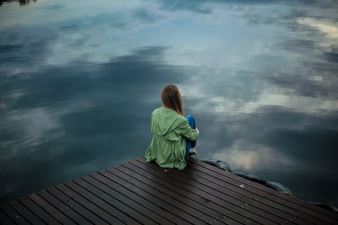 Free Woman Sitting on Wooden Planks Stock Photo Free Woman Sitting on Wooden Planks Stock Photo