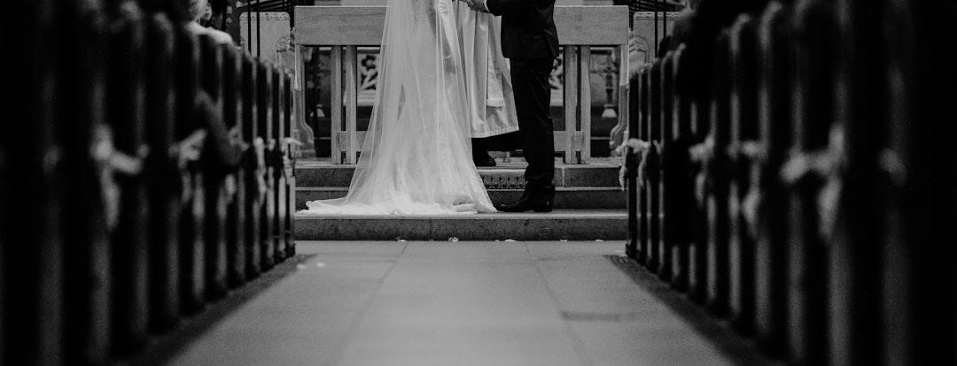 grayscale photo of groom and bride grayscale photo of groom and bride