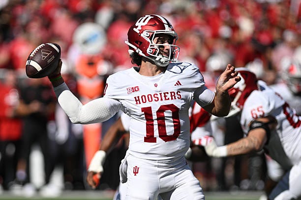 Josh Hoover of the Indiana Hoosiers drops back to pass against the Nebraska Cornhuskers during the first half at Memorial Stadium on October 10, 2026... Josh Hoover of the Indiana Hoosiers drops back to pass against the Nebraska Cornhuskers during the first half at Memorial Stadium on October 10, 2026...