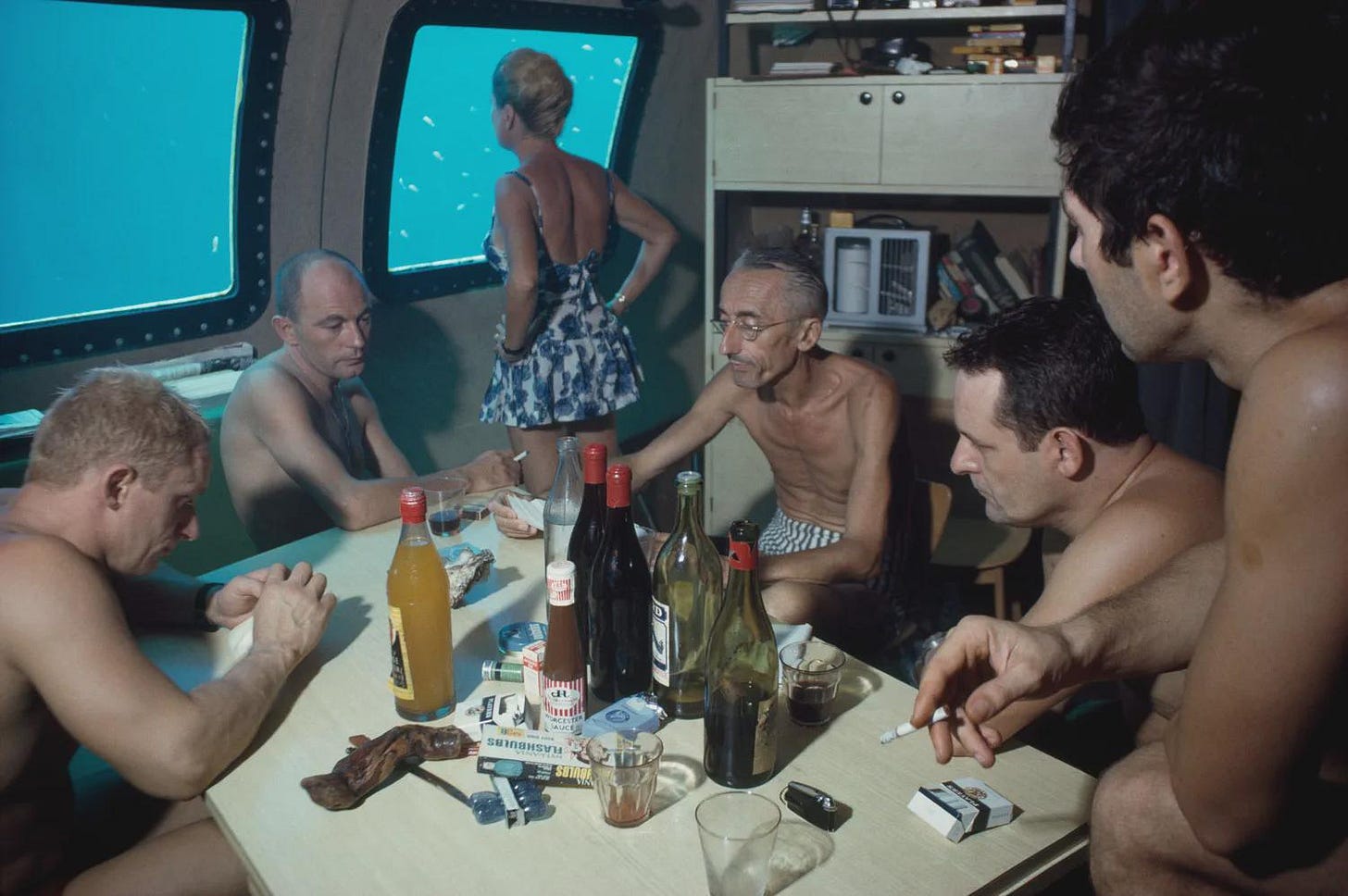 Legendary oceanographer Jacques Cousteau and his dedicated crew exploring the depths in a submersible during the groundbreaking Conshelf II Expedition in the Red Sea, 1963.