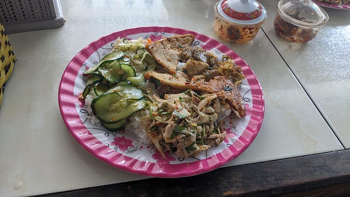 rice plate and outside of the vegetarian eatery