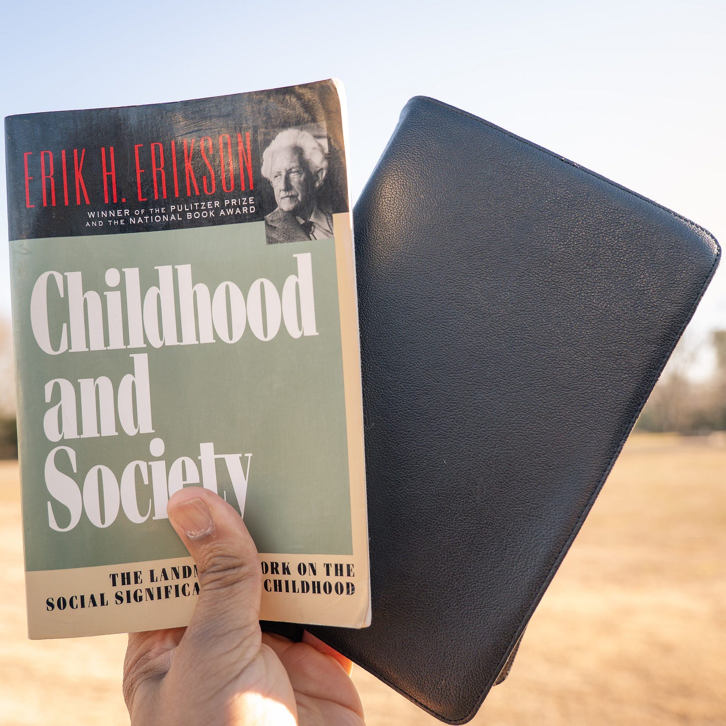A Bible In One Hand. A Book In The Other