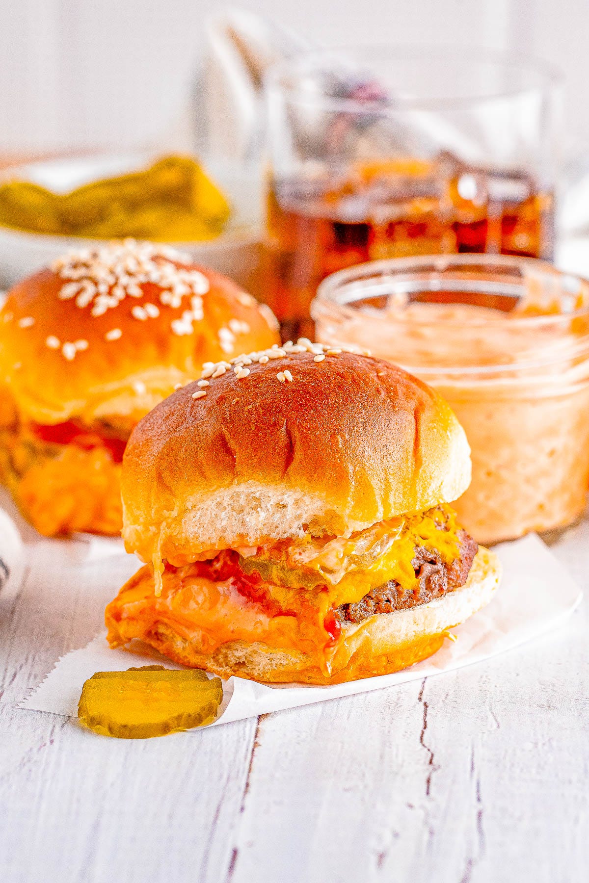 Big Mac Sliders - For anyone who likes the restaurant version, you're going to LOVE this homemade big mac copycat recipe in handheld slider form! Complete with a COPYCAT big mac special sauce, melted cheese, pickles, and tender beef all nestled between soft buttery buns. These EASY sandwiches are a family favorite FAST dinner recipe or make them for events, holidays, or game day parties! Big Mac Sliders - For anyone who likes the restaurant version, you're going to LOVE this homemade big mac copycat recipe in handheld slider form! Complete with a COPYCAT big mac special sauce, melted cheese, pickles, and tender beef all nestled between soft buttery buns. These EASY sandwiches are a family favorite FAST dinner recipe or make them for events, holidays, or game day parties!