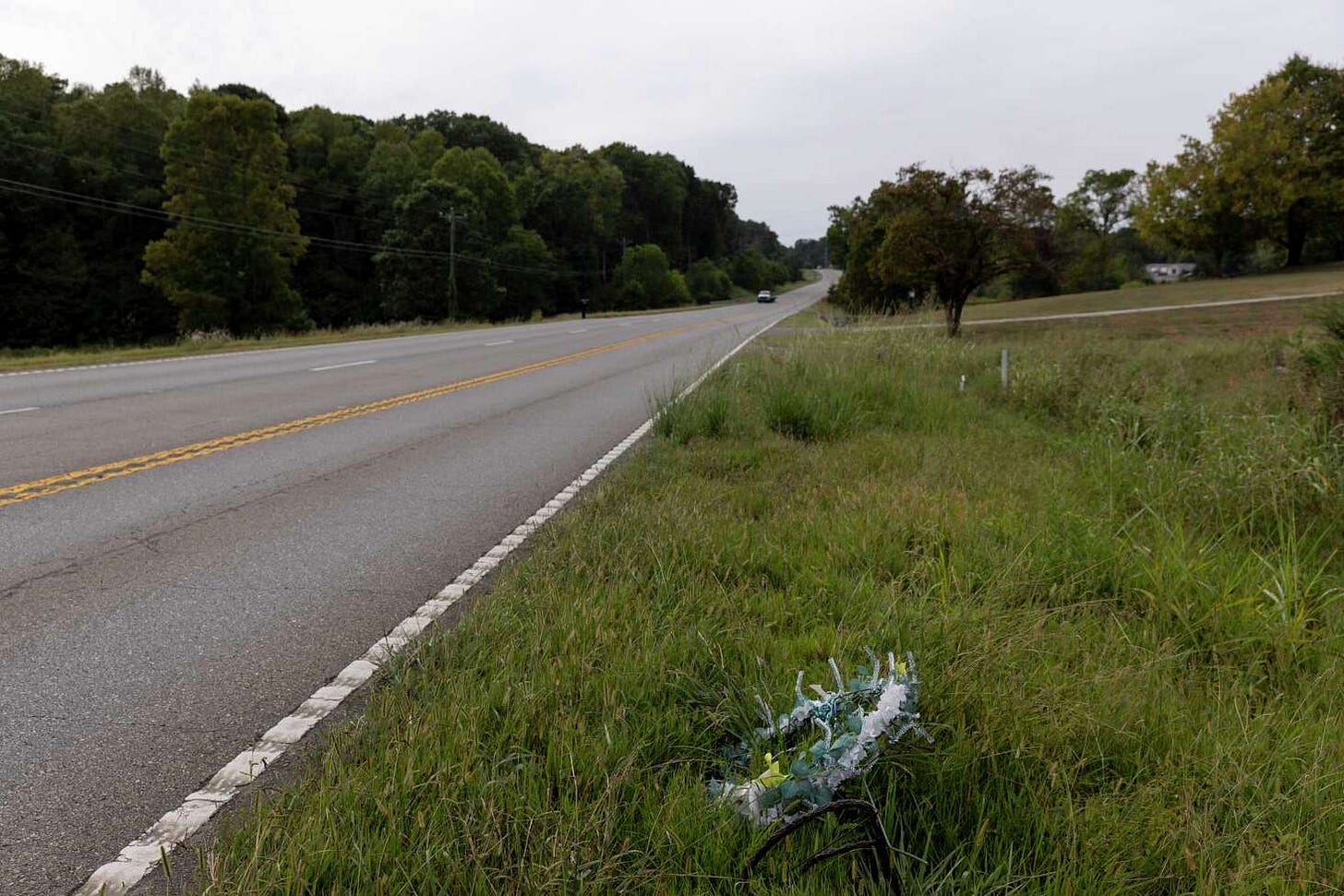 Dustin Thomas was killed when police were pursuing a driver and used a PIT maneuver to stop him. Dustin, who was riding a four-wheeler on the side of the road, was struck and killed. A wreath honors his memory along Highway 53 in Fairmount, Ga., on Sept. 11, 2024. Dustin Thomas was killed when police were pursuing a driver and used a PIT maneuver to stop him. Dustin, who was riding a four-wheeler on the side of the road, was struck and killed. A wreath honors his memory along Highway 53 in Fairmount, Ga., on Sept. 11, 2024.