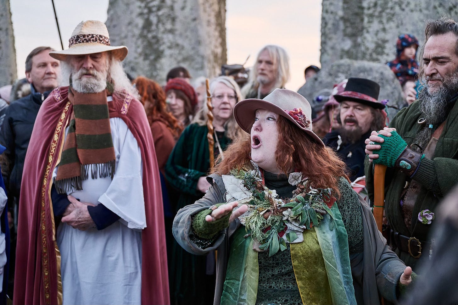 Documentary fieldwork photograph of Druids inside Stonehenge Stone Circle, showing spellbinding storytelling at the Spring Equinox sunrise Documentary fieldwork photograph of Druids inside Stonehenge Stone Circle, showing spellbinding storytelling at the Spring Equinox sunrise