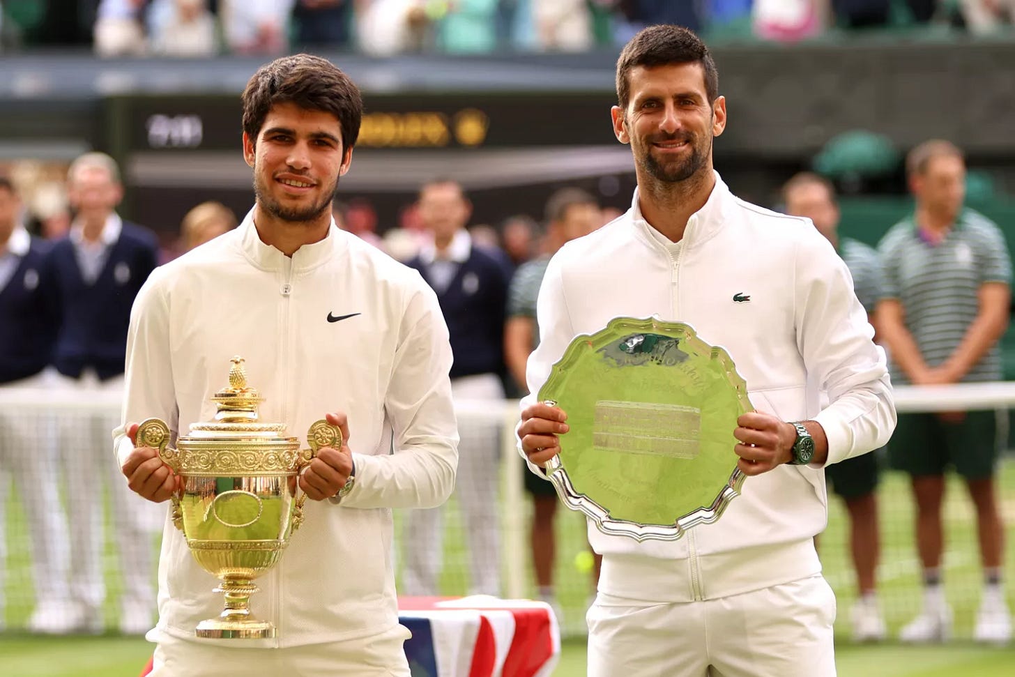 Carlos Alcaraz of Spain (L) holds the Men's Singles Trophy alongside Novak Djokovic of Serbia Carlos Alcaraz of Spain (L) holds the Men's Singles Trophy alongside Novak Djokovic of Serbia
