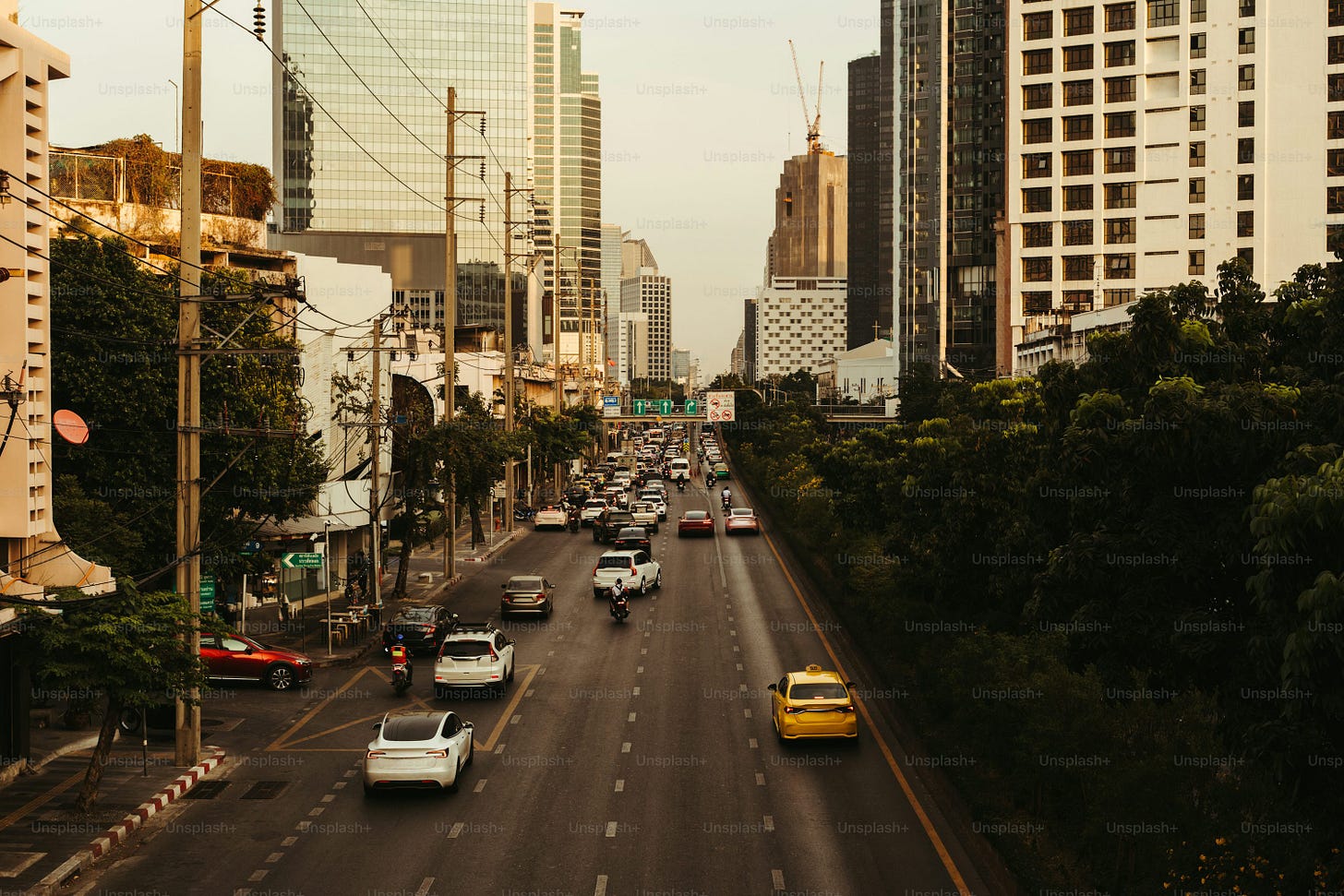 A view of a city street with tall buildings