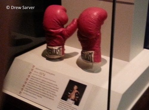 The day after Ali died, I happened to be in the American History Museum in Washington, D.C. and saw these on exhibit. The day after Ali died, I happened to be in the American History Museum in Washington, D.C. and saw these on exhibit.