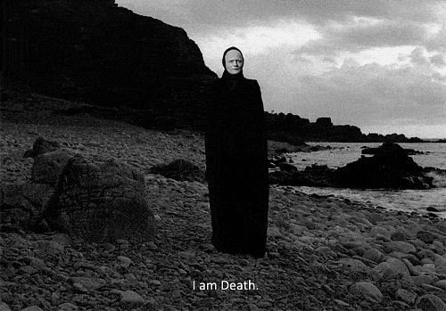 Death stands on the stony shore in The Seventh Seal, calmly introducing himself—symbolizing the quiet passing of once-dominant voices in the evolving canon.