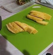 A cutting board with pineapple slices on it

AI-generated content may be incorrect.