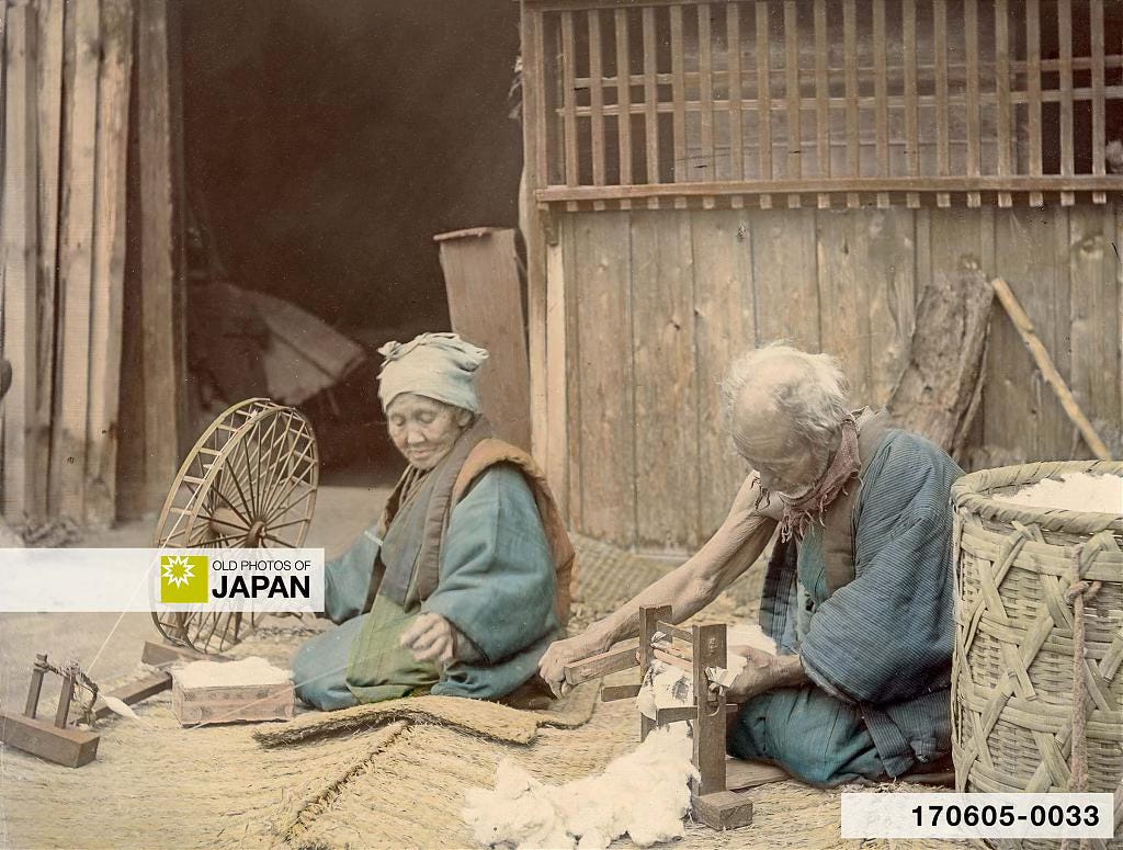 Elderly Japanese couple spinning cotton outside their home, 1890s Elderly Japanese couple spinning cotton outside their home, 1890s